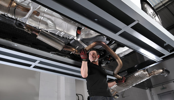 Stock systems are heavy, so make sure that you have help or can adequately support the system when it is released. Removing the old stock exhaust system